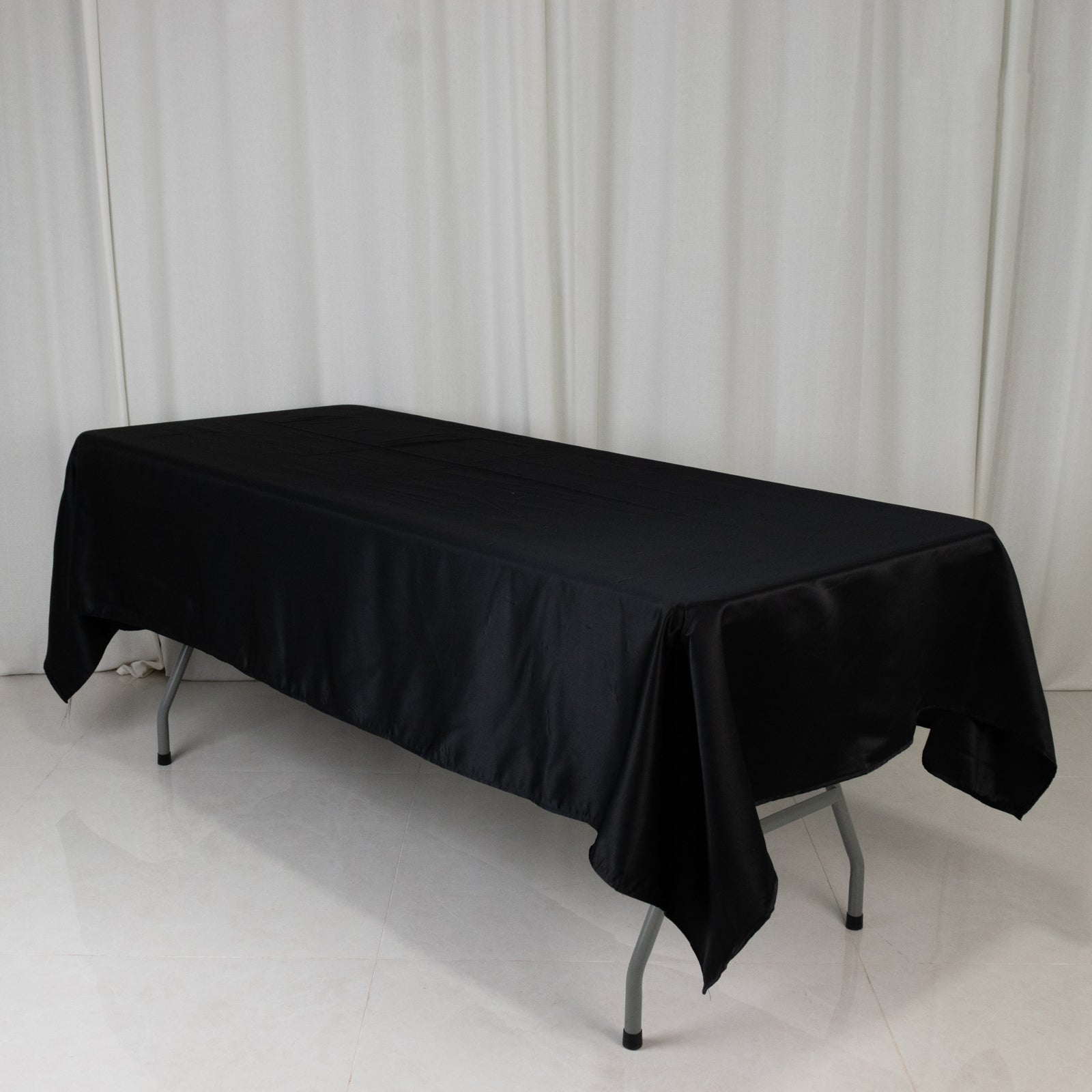 Black rectangular tablecloth, 60"x102", made of Lamour satin.
