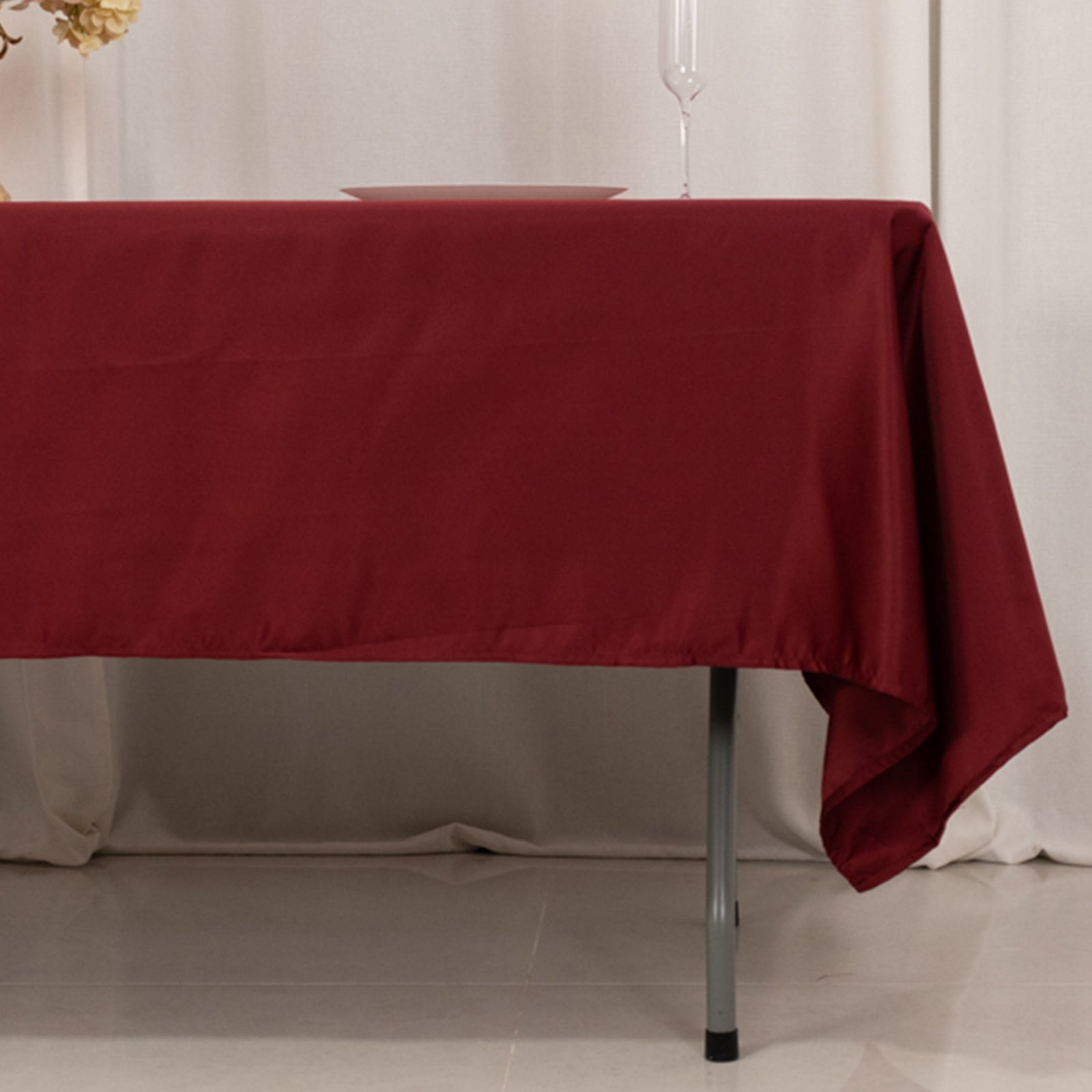 Burgundy satin rectangle tablecloth, 60"x102" for elegant dining settings.