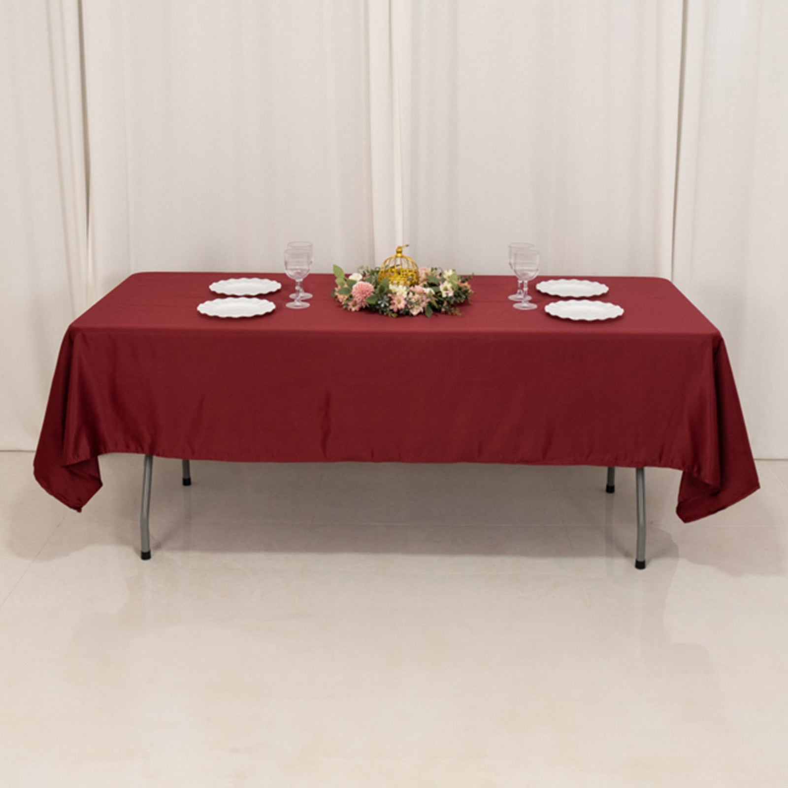 Burgundy satin rectangle tablecloth for elegant dining setups.