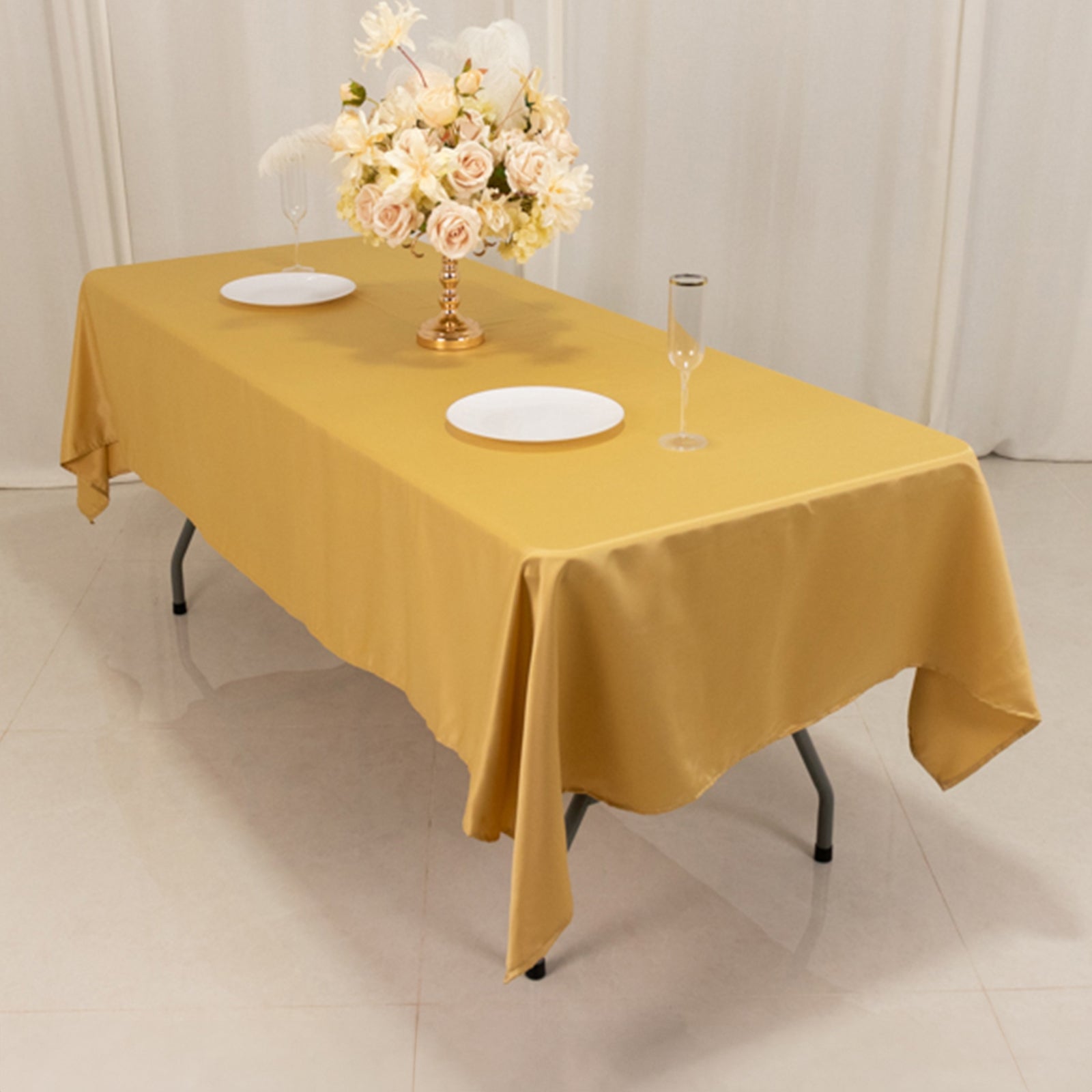 Champagne satin rectangle tablecloth on a dining table.