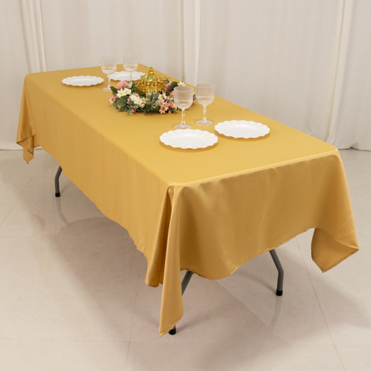 Champagne satin rectangle tablecloth on a dining table.