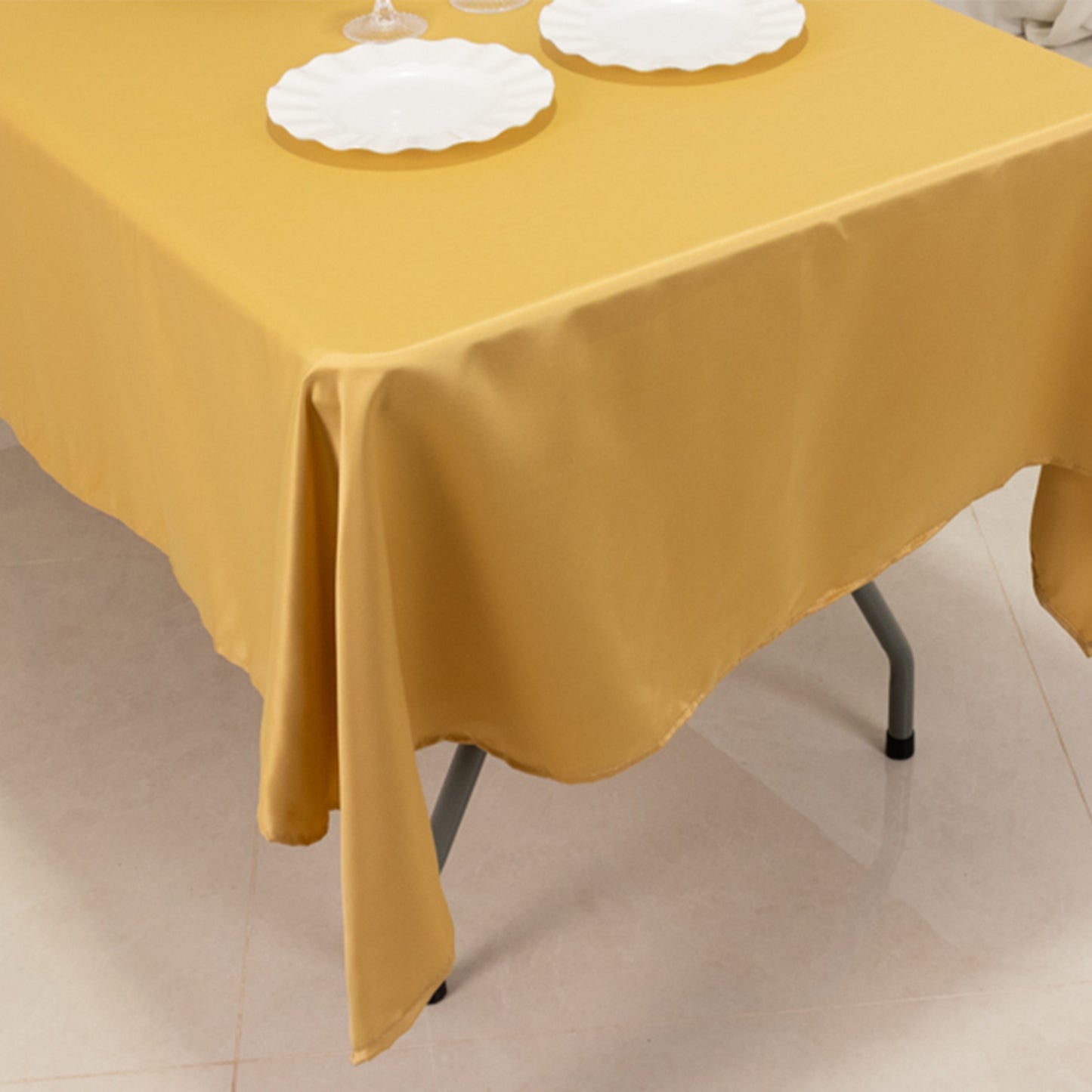 Champagne satin rectangle tablecloth on a dining table