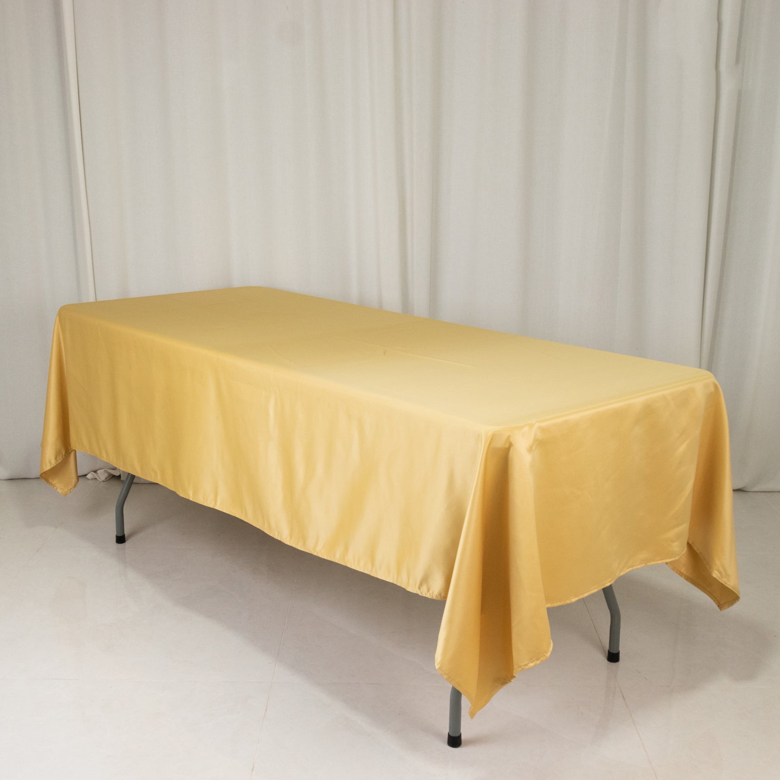 Champagne satin rectangle tablecloth, 60"x102" for elegant dining.
