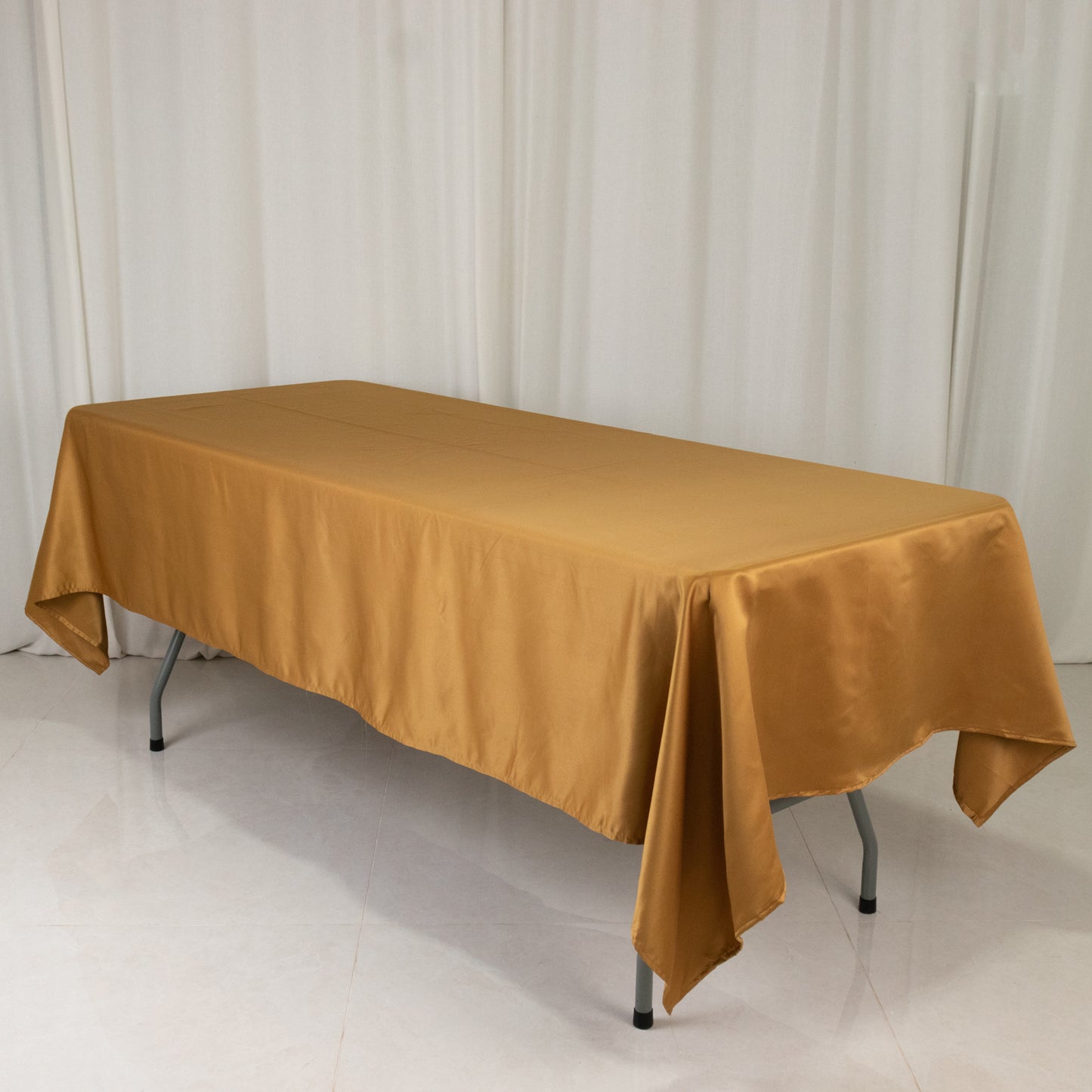 Gold satin rectangle tablecloth, 60"x102" size.