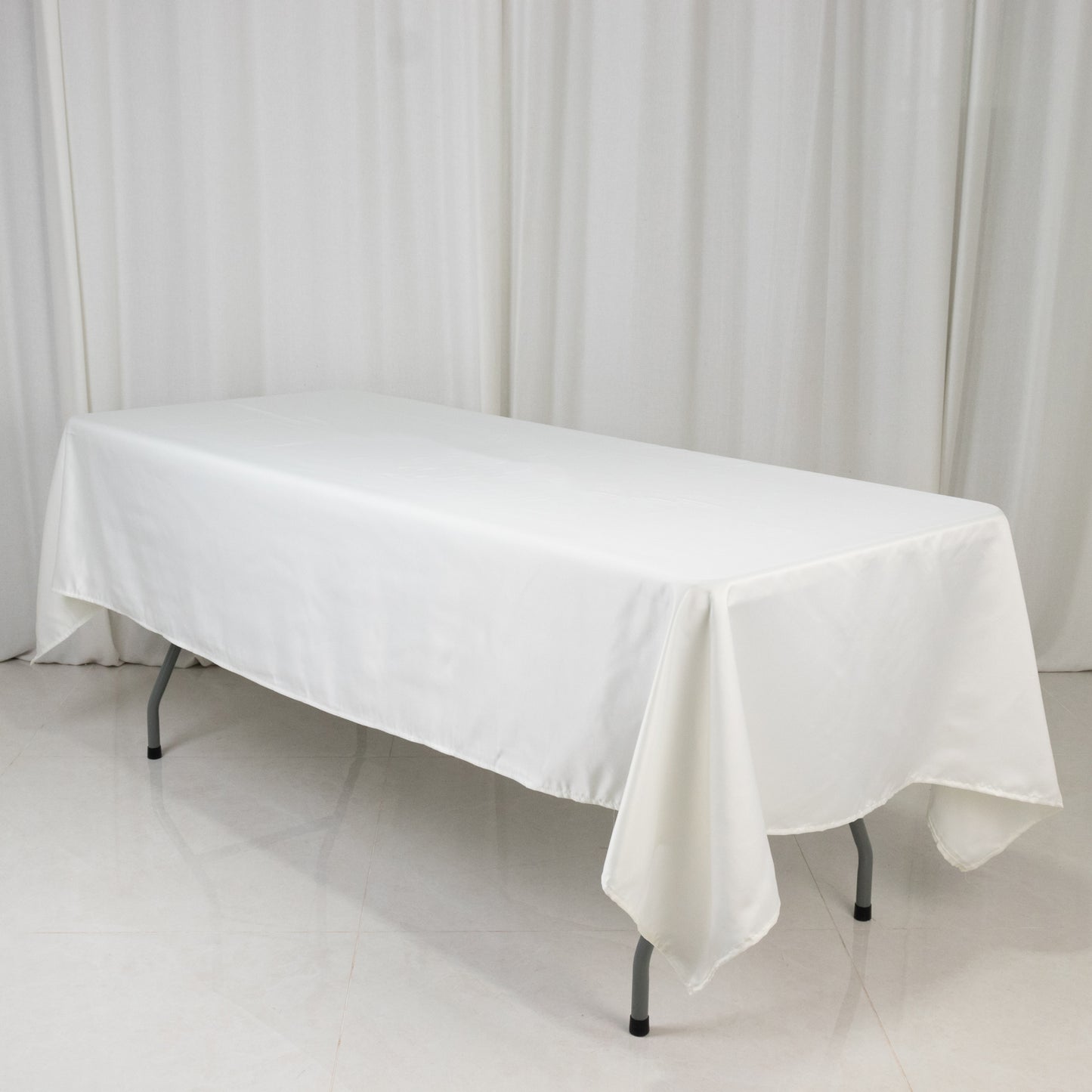 Ivory satin rectangle tablecloth, 60"x102" size.