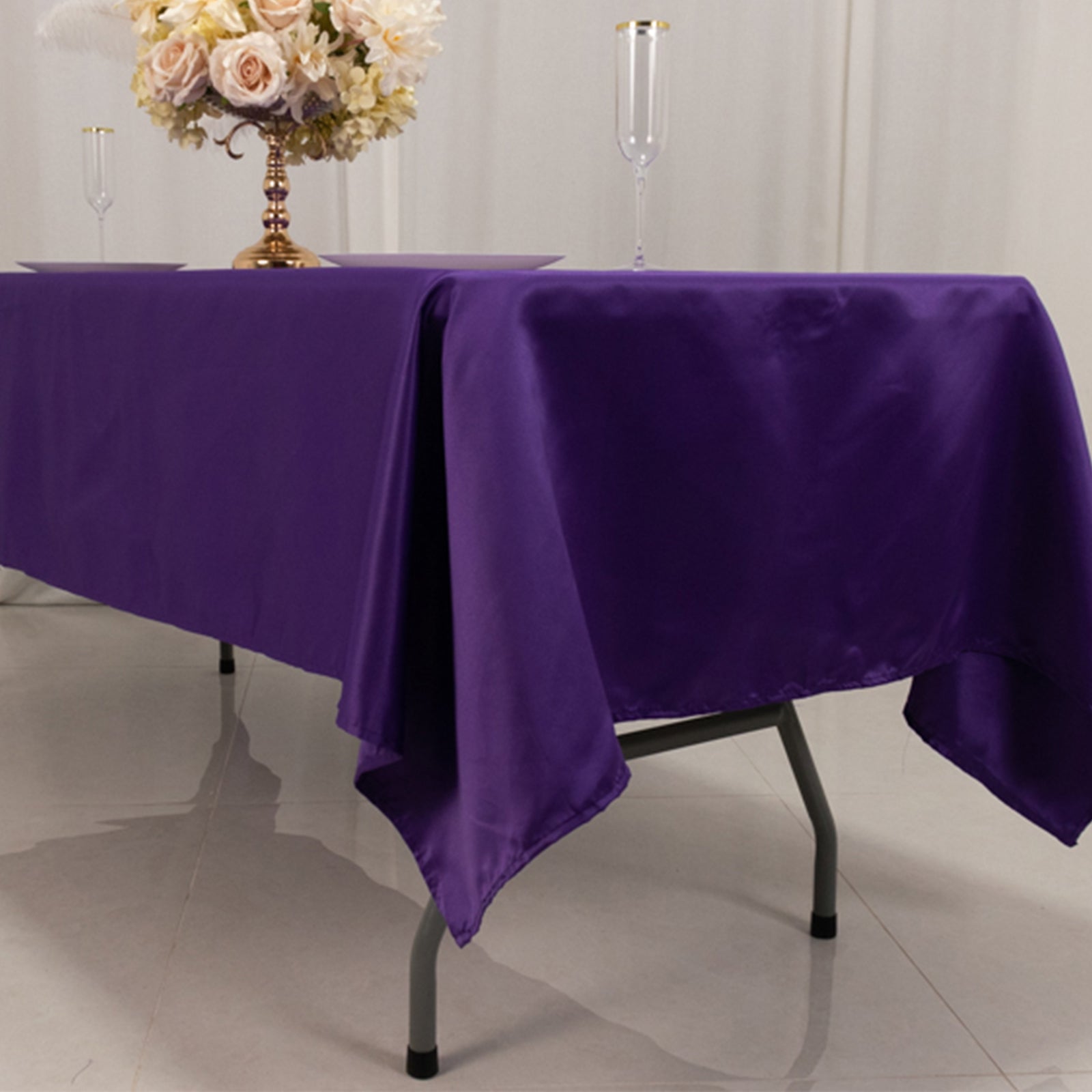 Purple Lamour satin rectangle tablecloth on a dining table.
