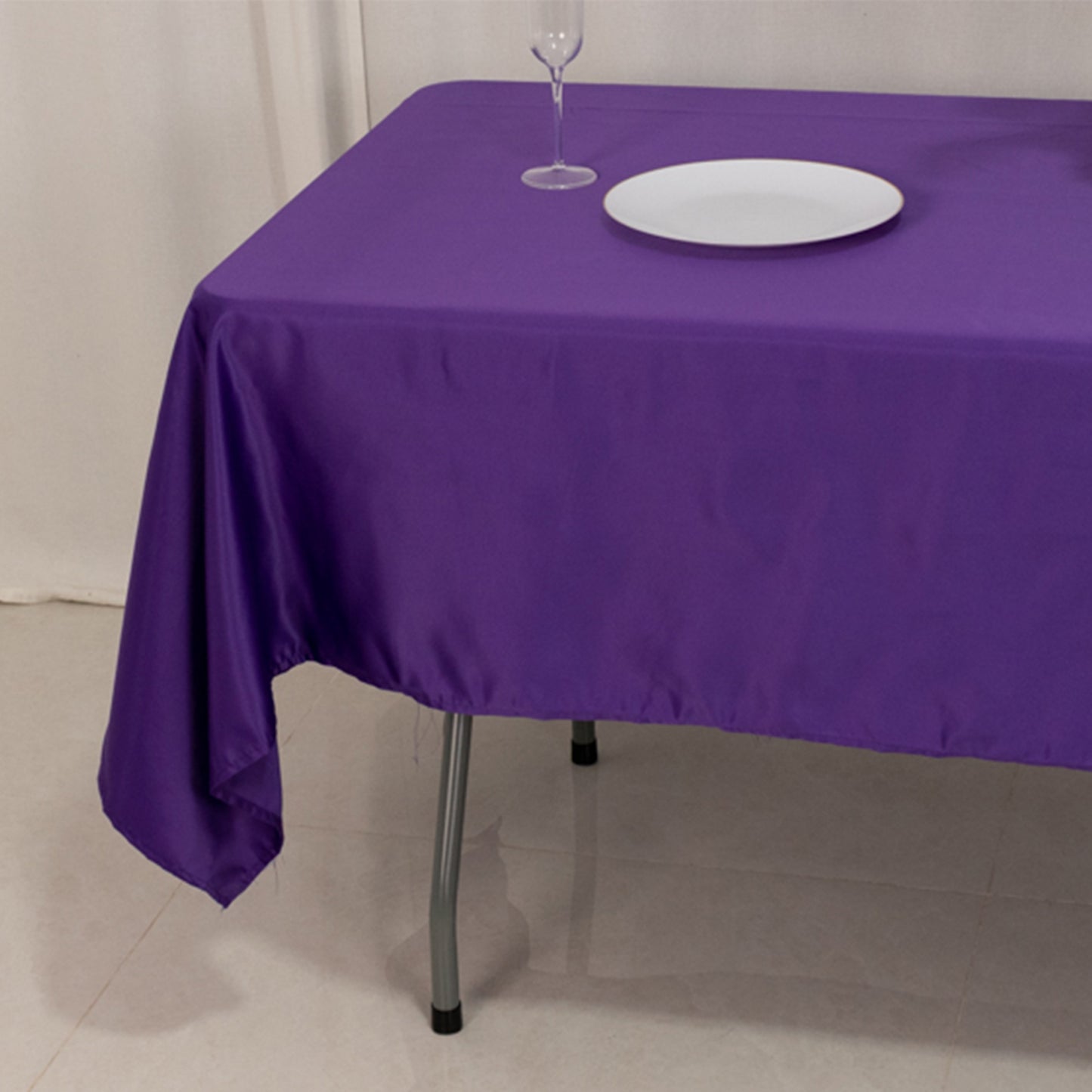 Purple Lamour satin rectangle tablecloth on a table.