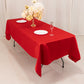 Red satin rectangle tablecloth on a table with a floral centerpiece.