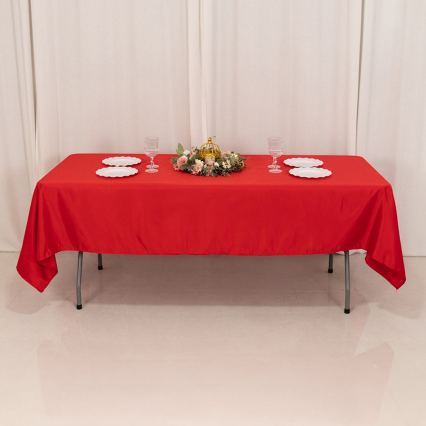 Red Lamour satin rectangle tablecloth on a dining table.