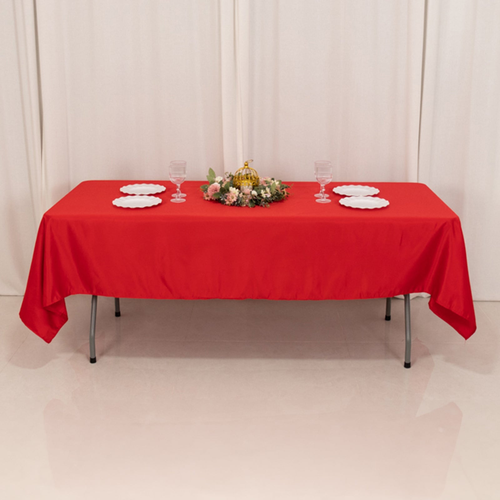 Red Lamour satin rectangle tablecloth on a dining table.