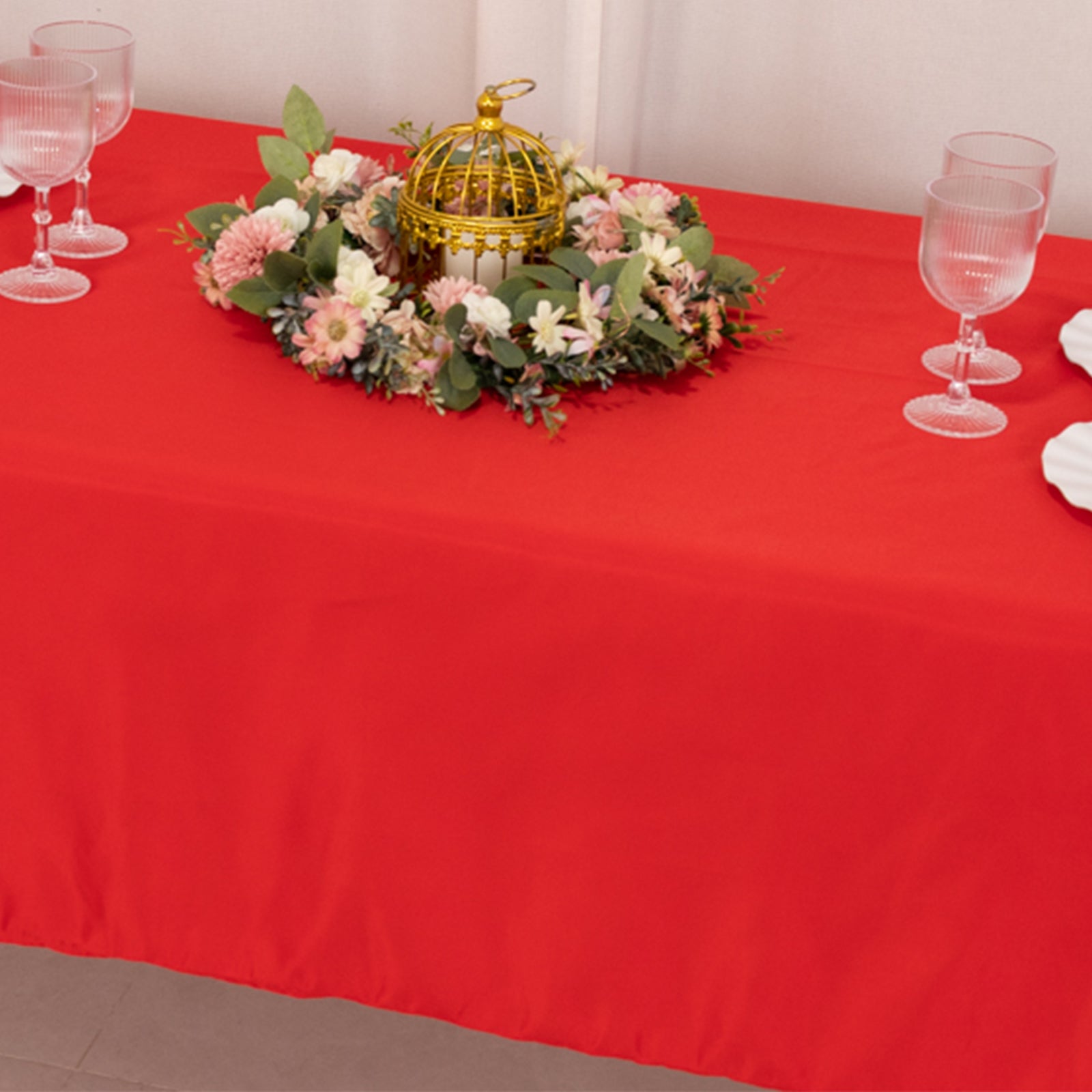 Red Lamour Satin Rectangle Tablecloth on a dining table.