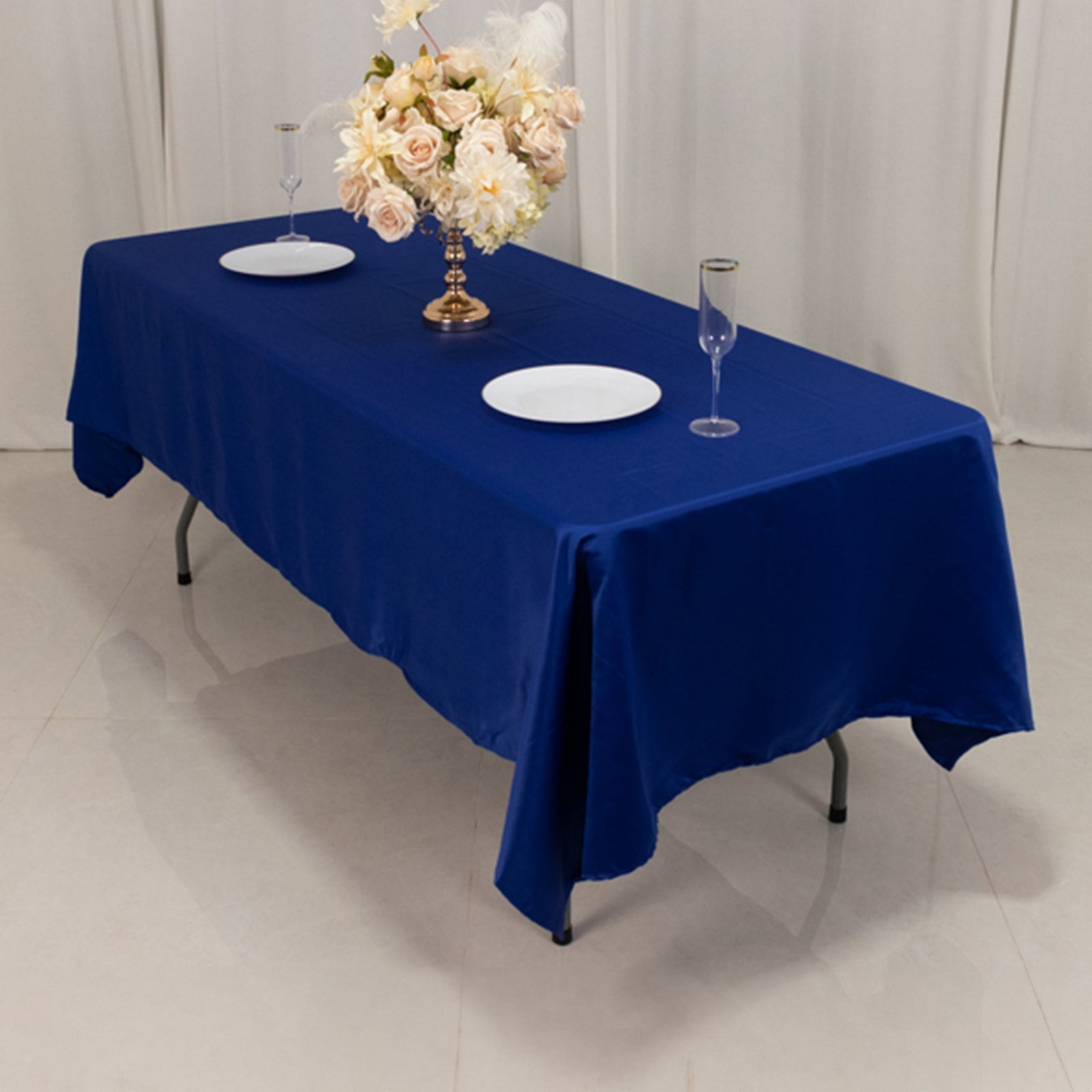 Royal Blue Lamour Satin Rectangle Tablecloth on a dining table.