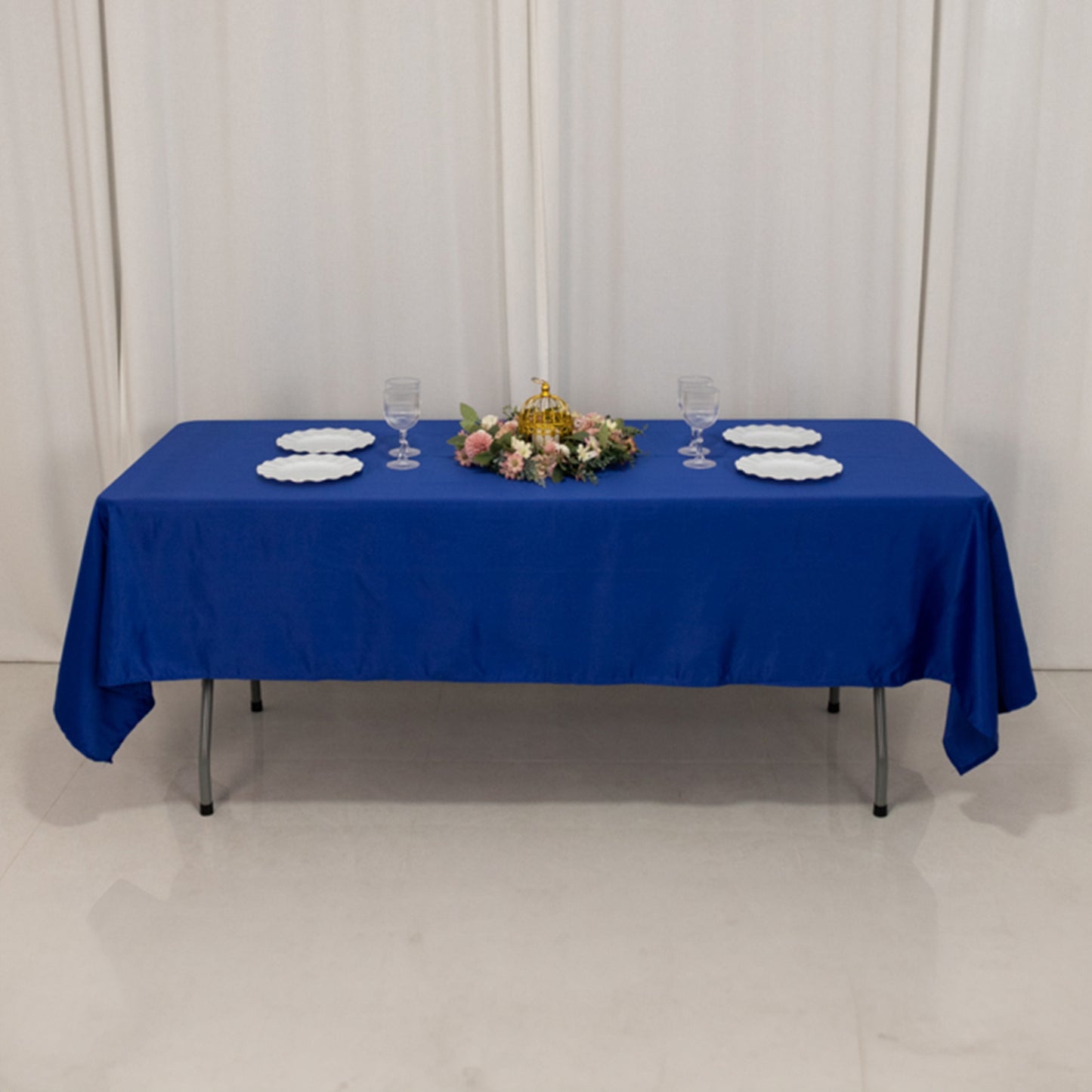 Royal Blue Lamour Satin Rectangle Tablecloth on a dining table.