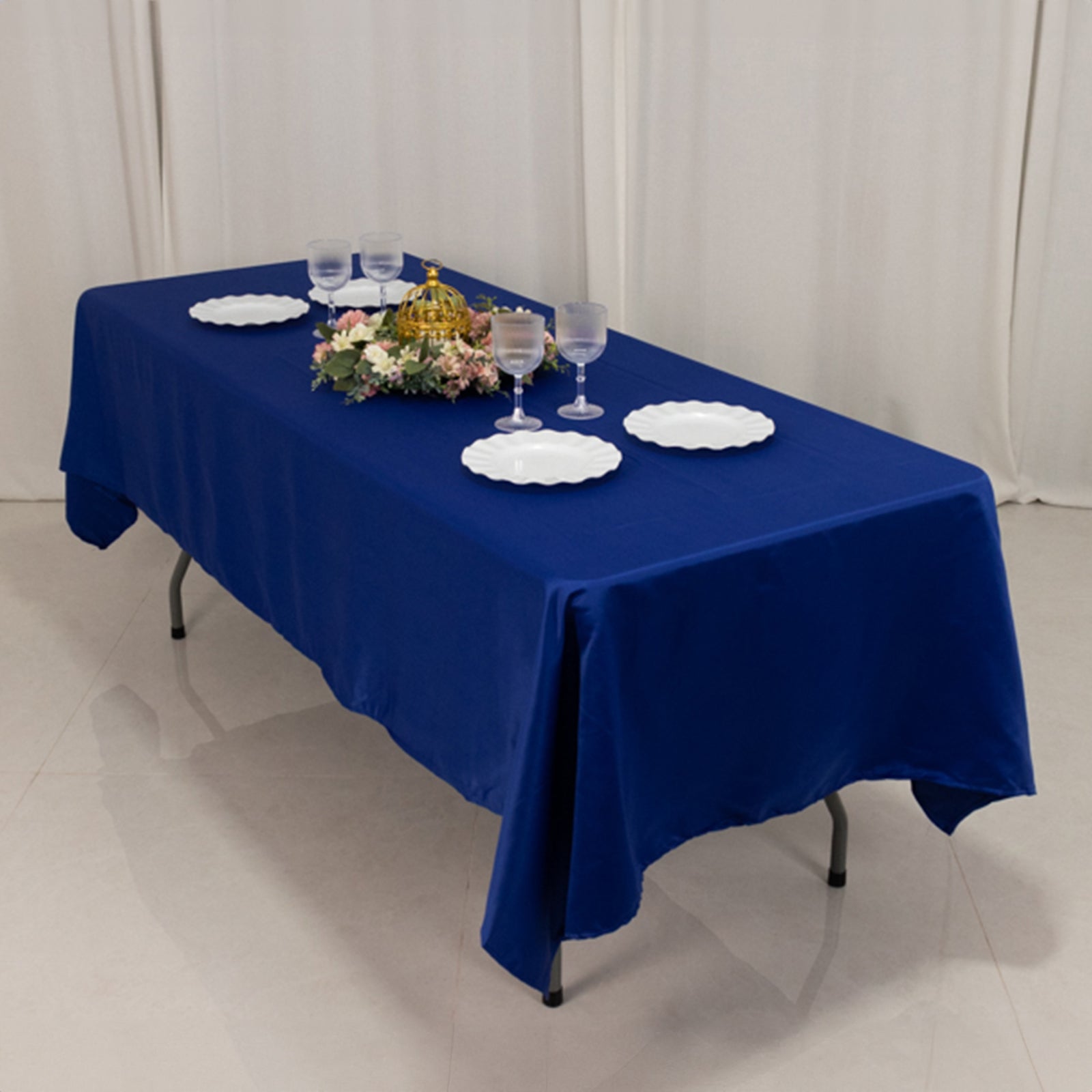 Royal Blue Lamour Satin Rectangle Tablecloth on a dining table.