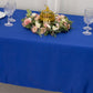 Royal blue rectangular tablecloth on a decorated table with floral arrangement.