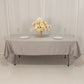 Silver satin rectangle tablecloth with a floral centerpiece.