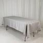 Silver rectangular satin tablecloth on a table.