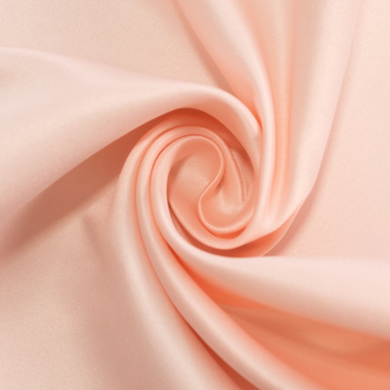 Blush satin tablecloth fabric in a smooth swirl pattern.