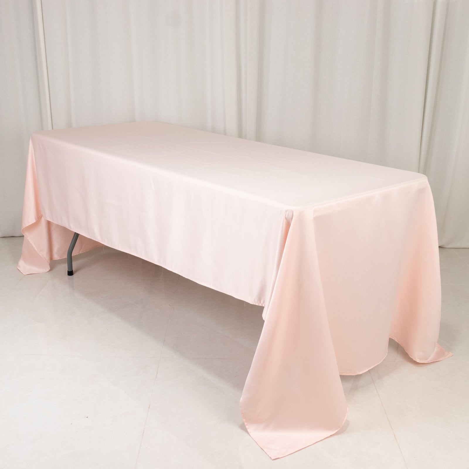 Blush satin rectangular tablecloth, 60"x126" for elegant table settings.