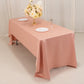Dusty rose satin rectangle tablecloth on a dining table.