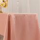 Dusty rose satin rectangle tablecloth on a dining table.