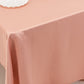 Dusty rose satin rectangle tablecloth on a table.