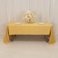 Champagne satin tablecloth draped elegantly on a table with floral centerpiece.