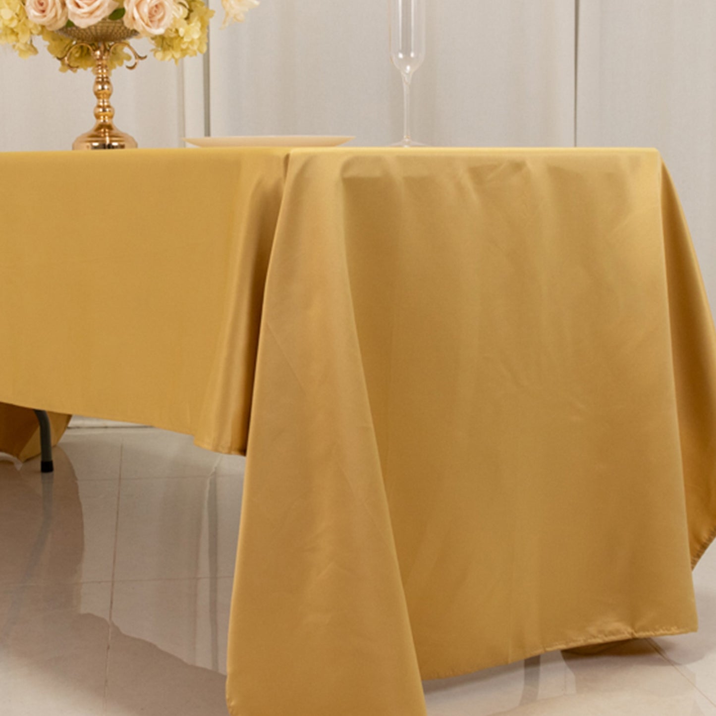champagne satin rectangle tablecloth on a dining table