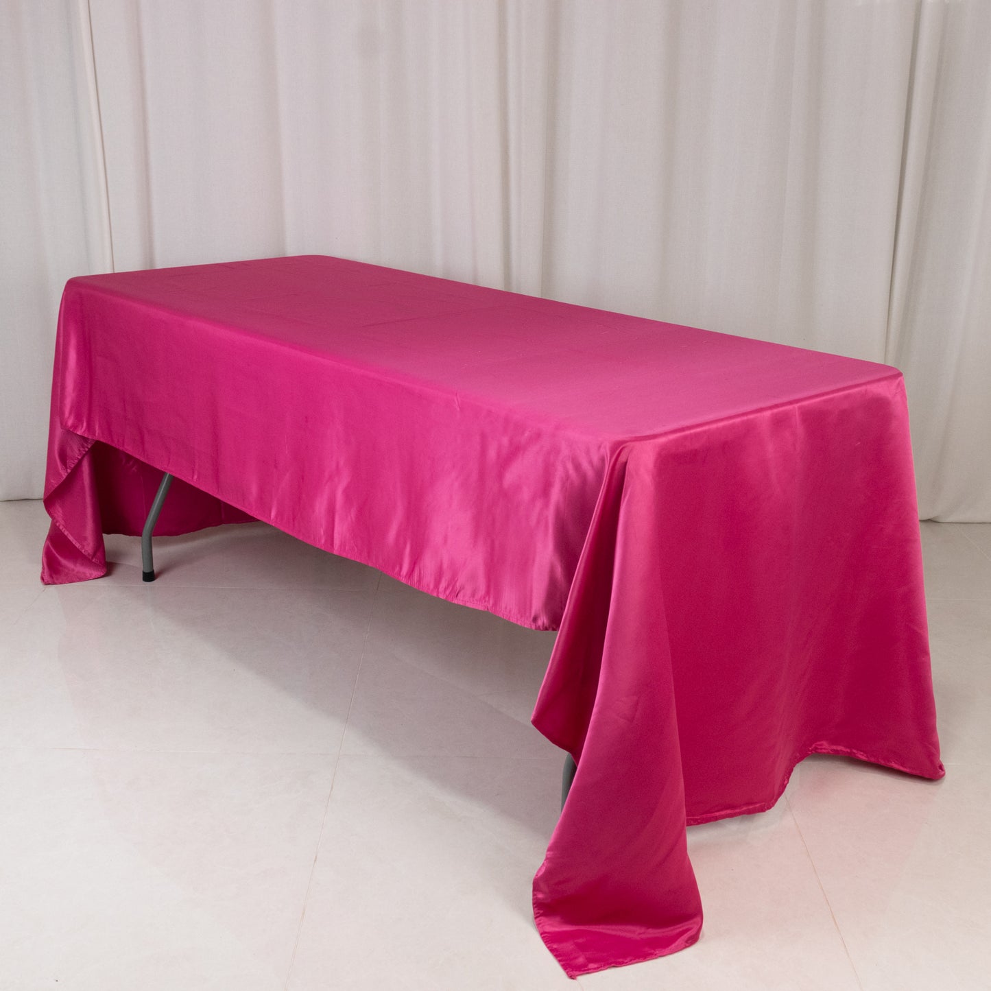 Fuchsia satin rectangle tablecloth, 60"x126" for elegant dining setups.