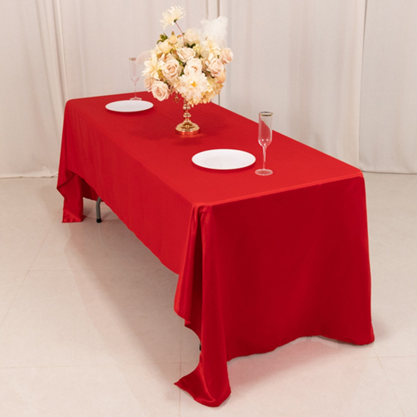 Red Lamour satin rectangle tablecloth on a dining table.