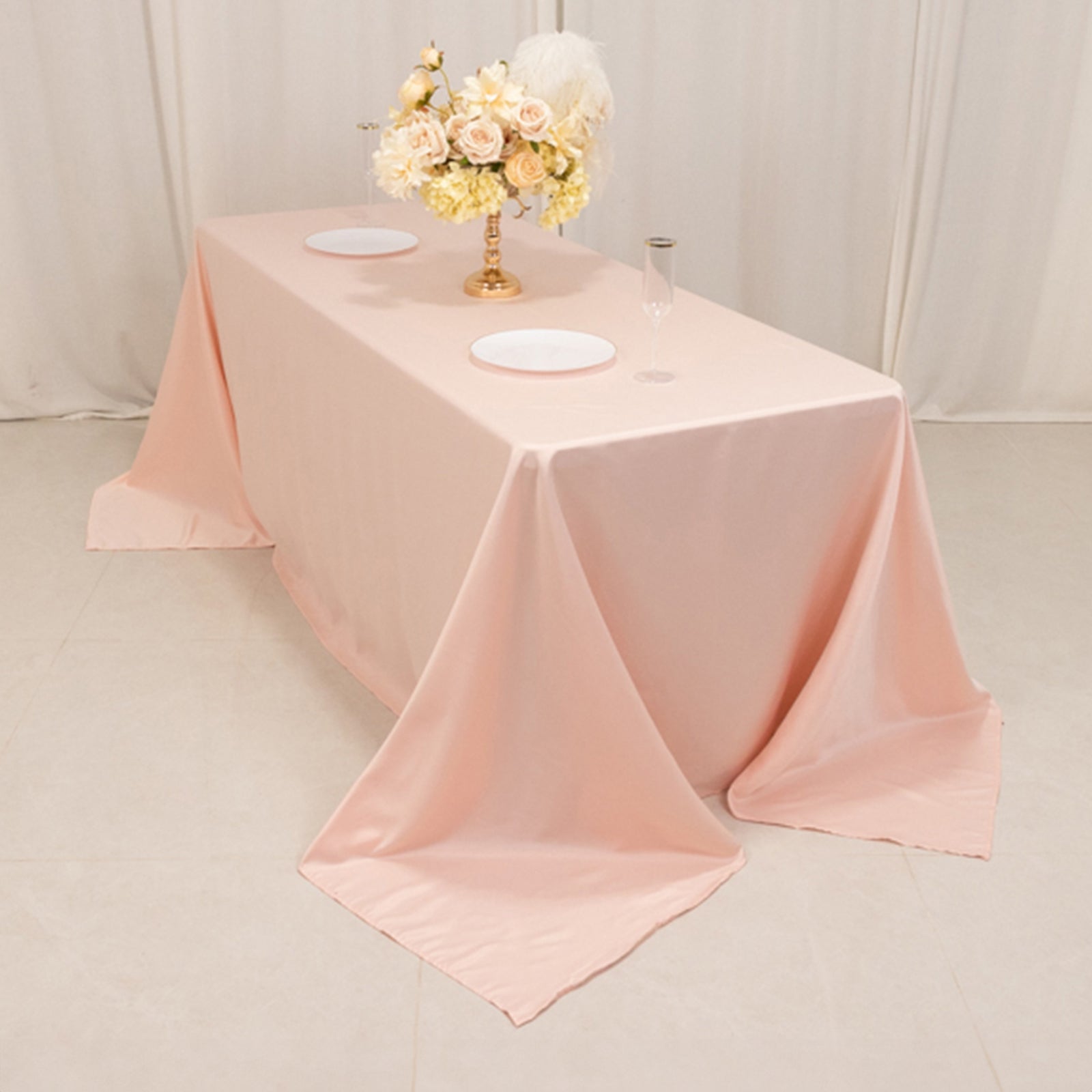Blush satin tablecloth for a 6-foot table with floor-length drop.