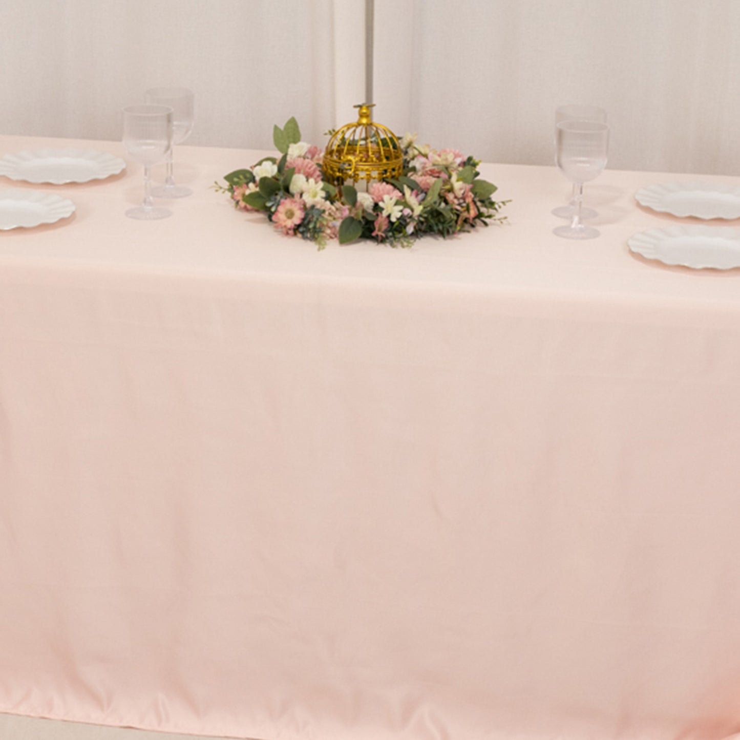 Blush satin tablecloth for 6-foot table with floor-length drop.