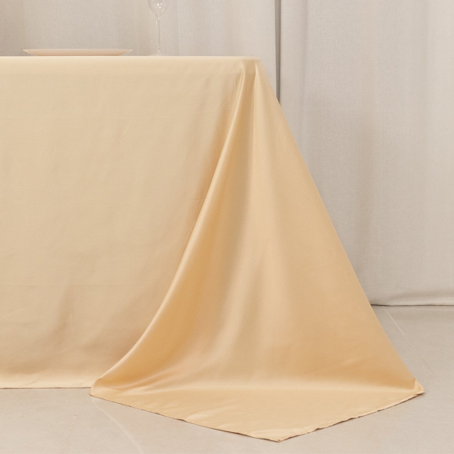 Beige satin tablecloth for 6-foot table with floor-length drop.