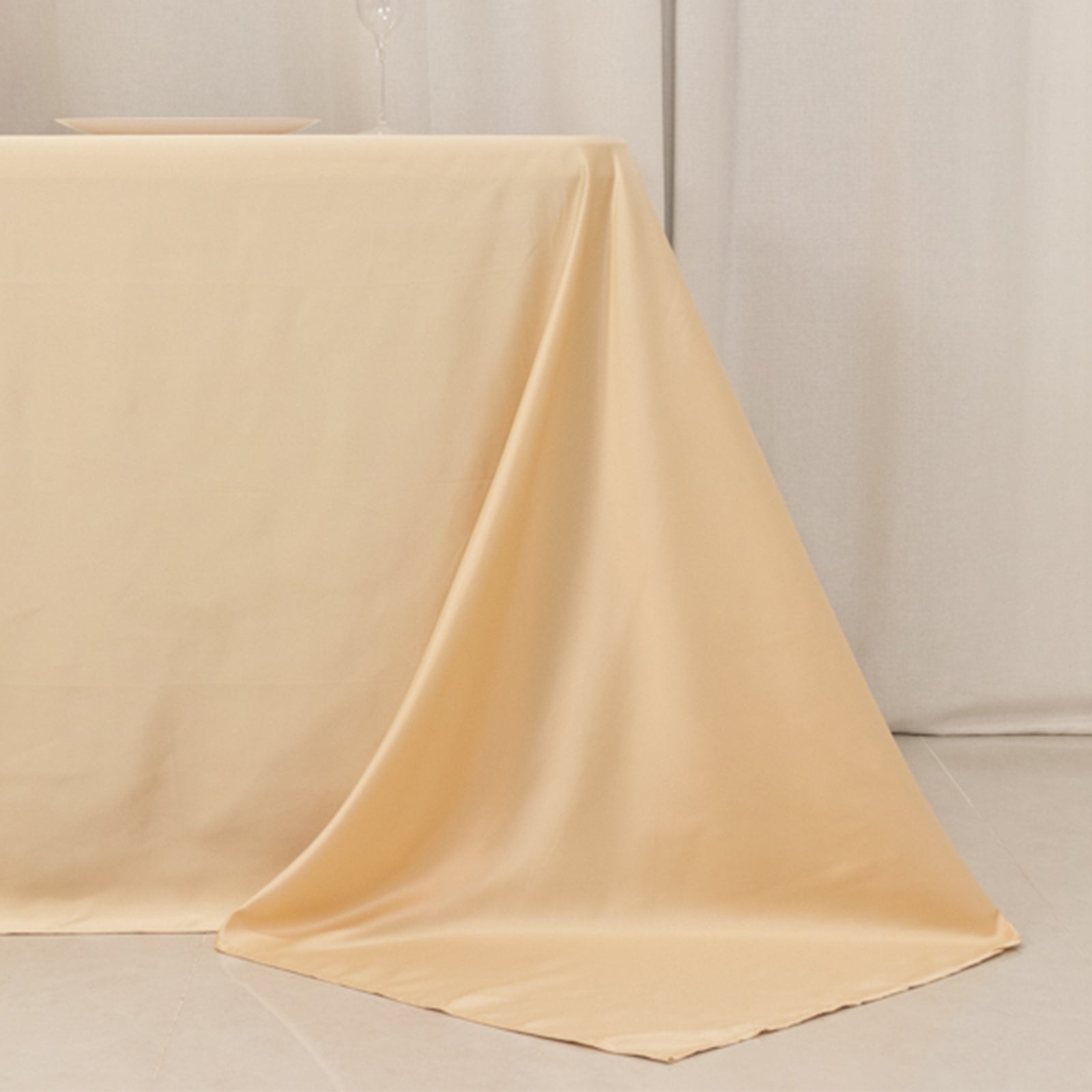 Beige satin tablecloth for 6-foot table with floor-length drop.