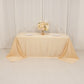 Beige seamless satin tablecloth for 6-foot table with floor-length drop.