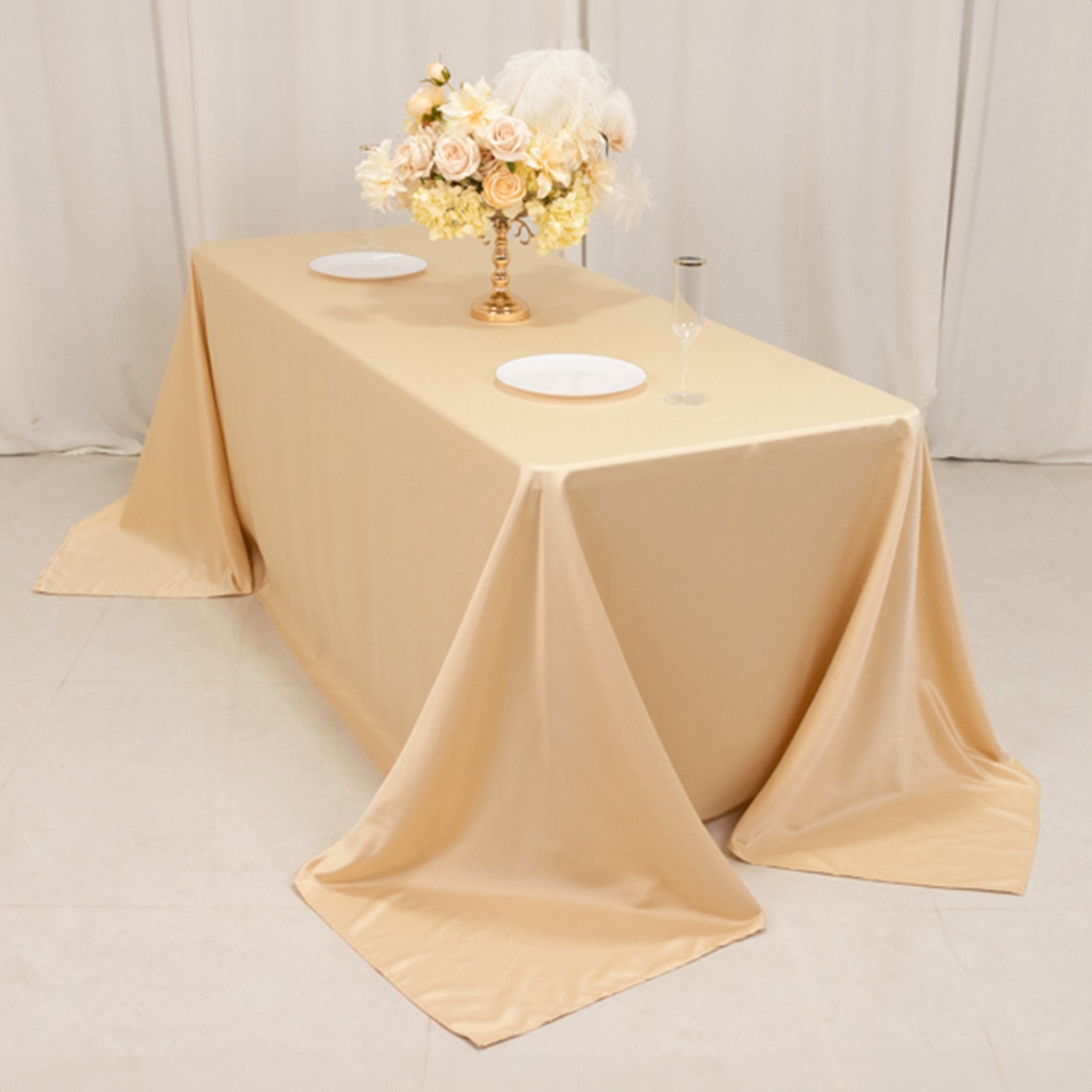 Beige seamless satin tablecloth for 6-foot table with floor-length drop.