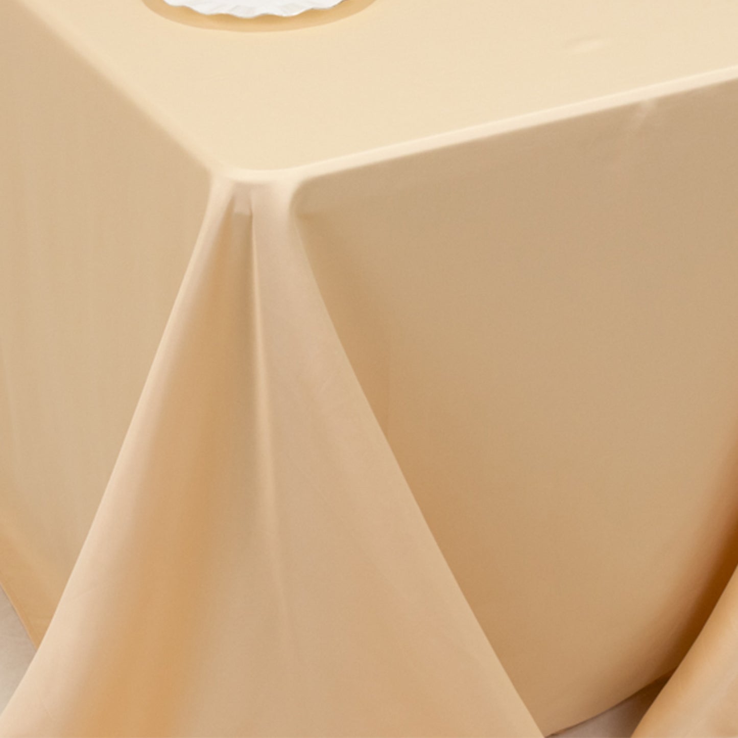 Beige satin tablecloth for 6-foot table with floor-length drop.