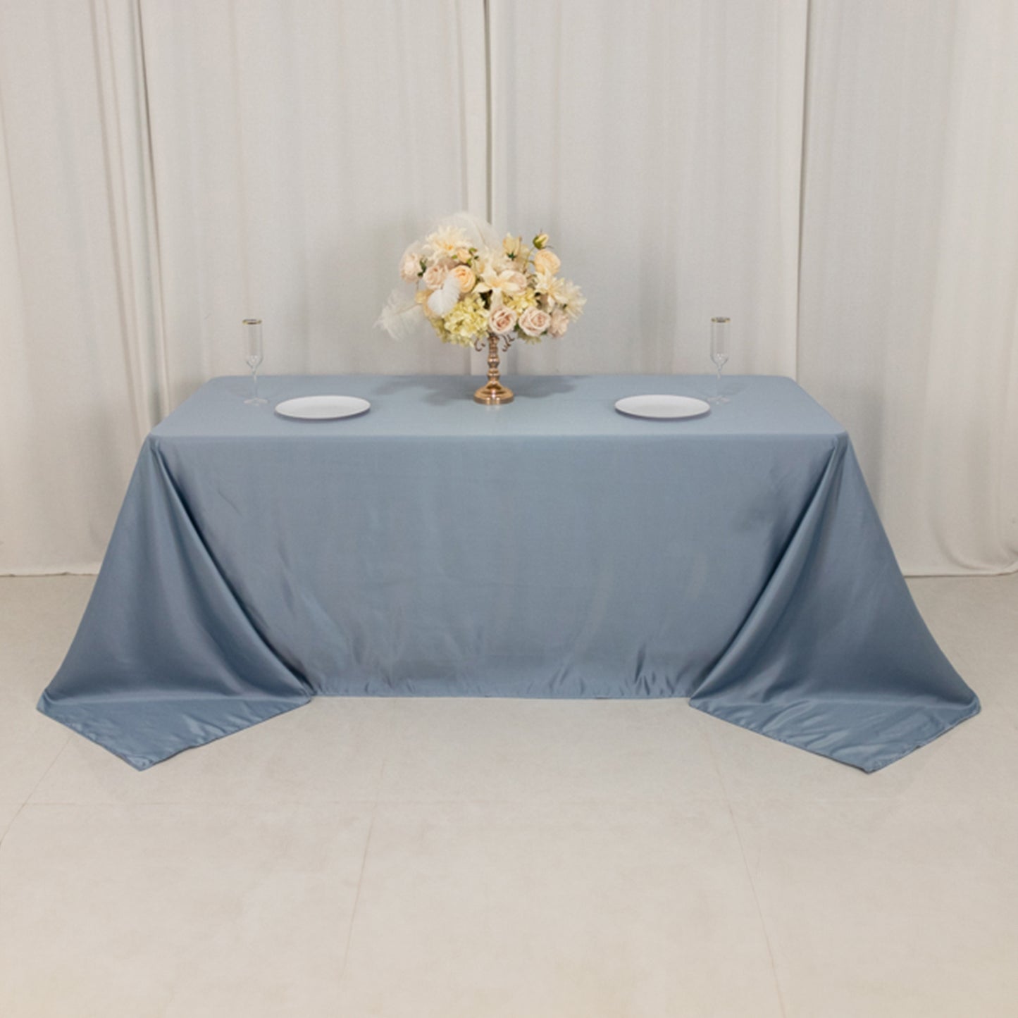 Dusty blue seamless satin tablecloth for 6-foot table with floor-length drop.