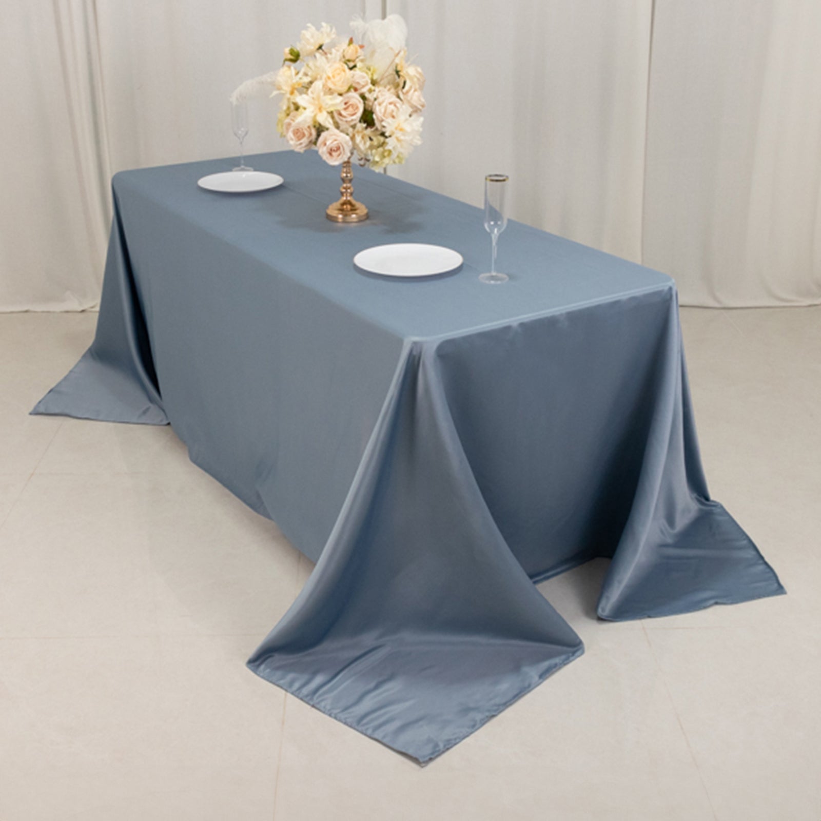 Dusty blue satin tablecloth for a 6-foot table with floor-length drop.