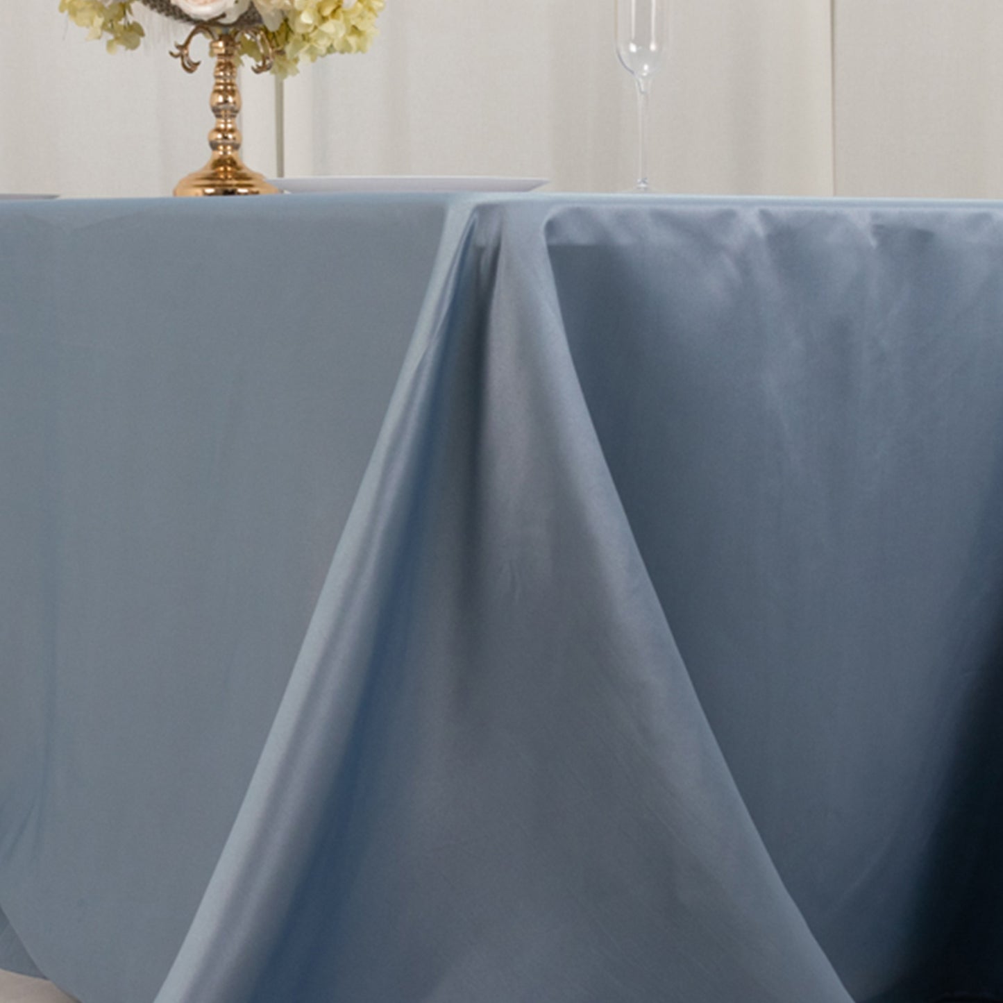Dusty blue satin tablecloth for a 6-foot table with floor-length drop.