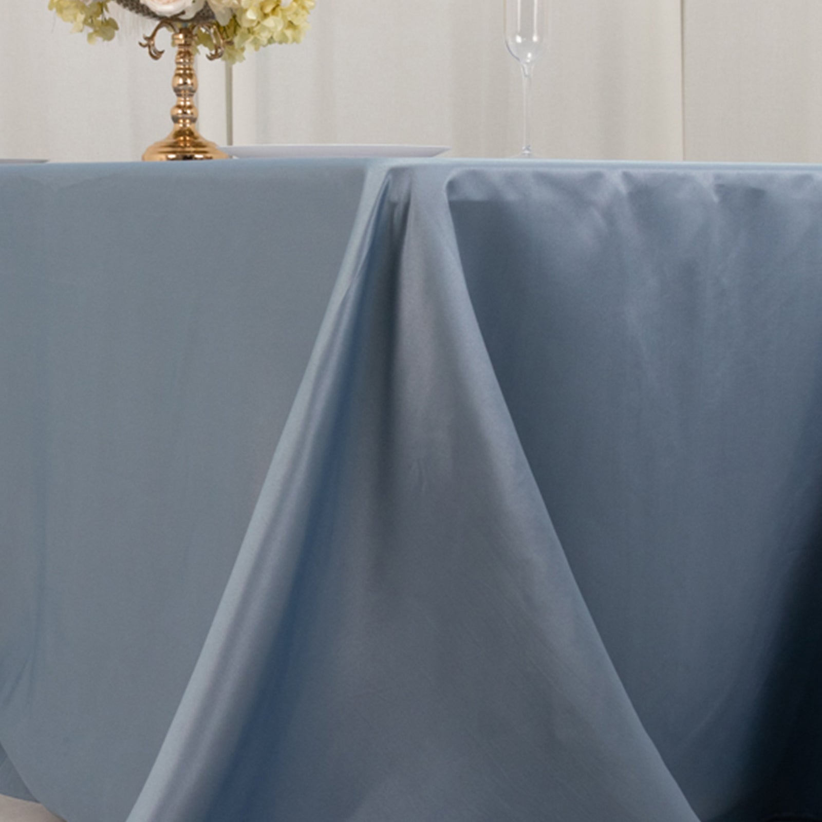 Dusty blue satin tablecloth for a 6-foot table with floor-length drop.