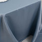 Dusty blue satin tablecloth for 6-foot table with floor-length drop.