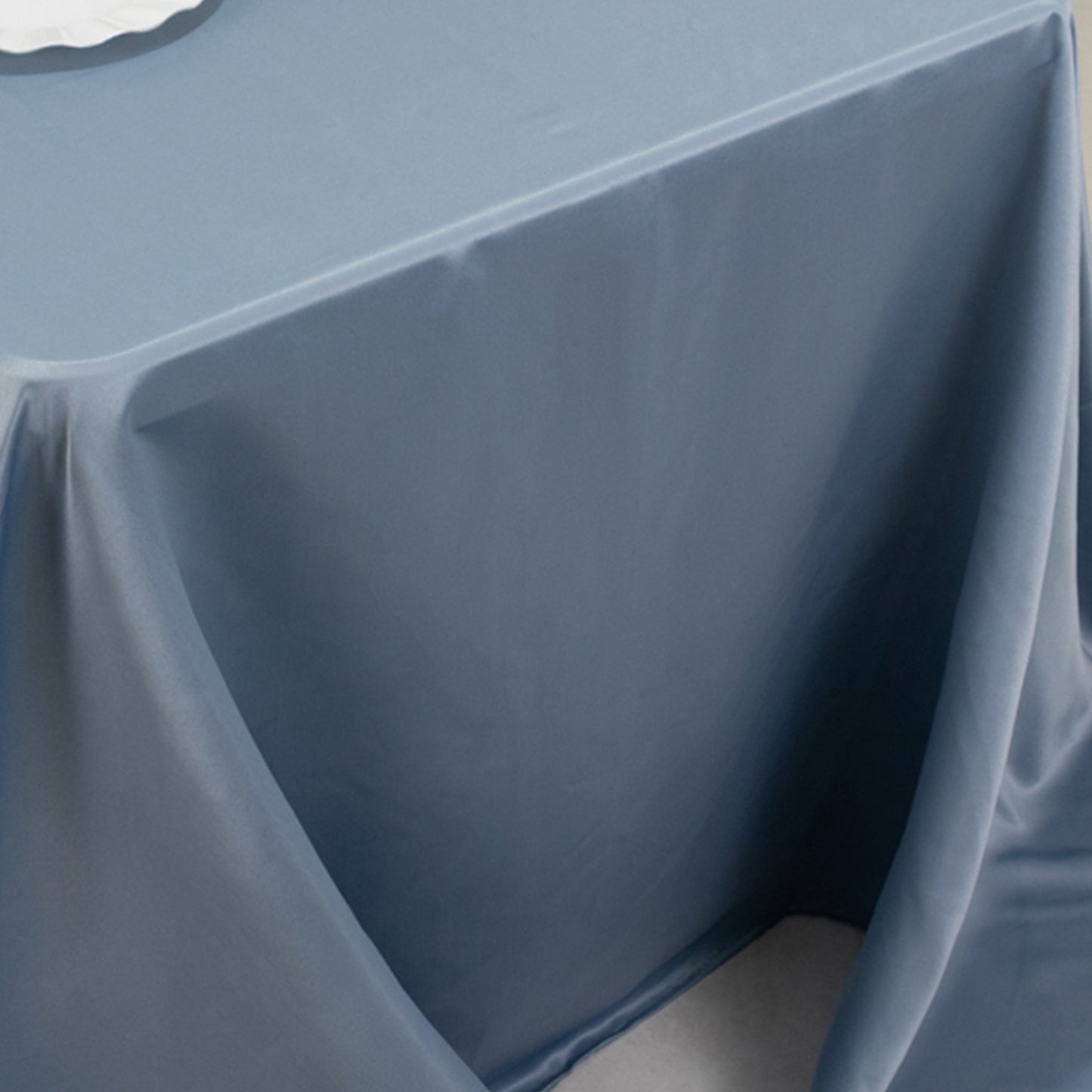 Dusty blue satin tablecloth for 6-foot table with floor-length drop.
