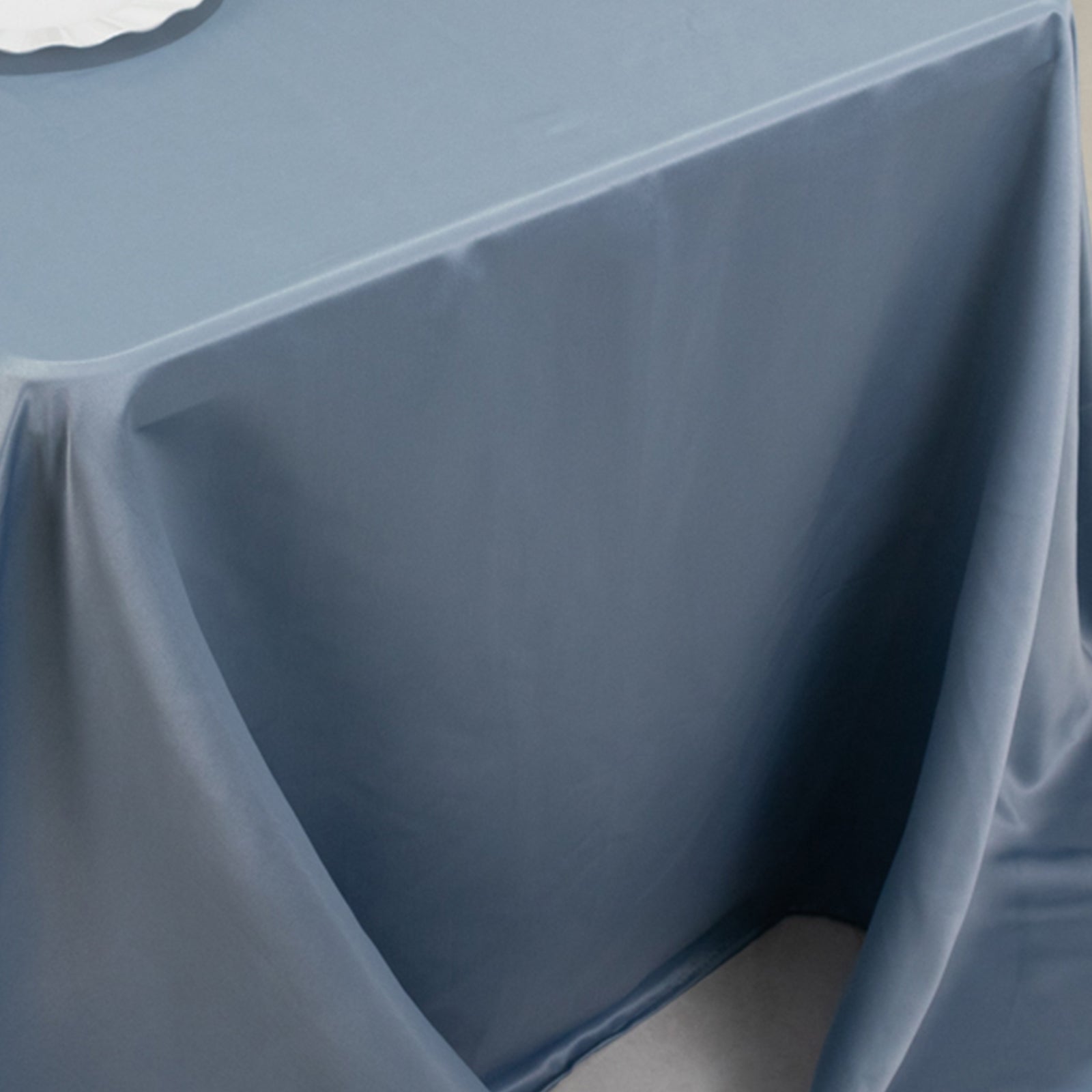 Dusty blue satin tablecloth for 6-foot table with floor-length drop.
