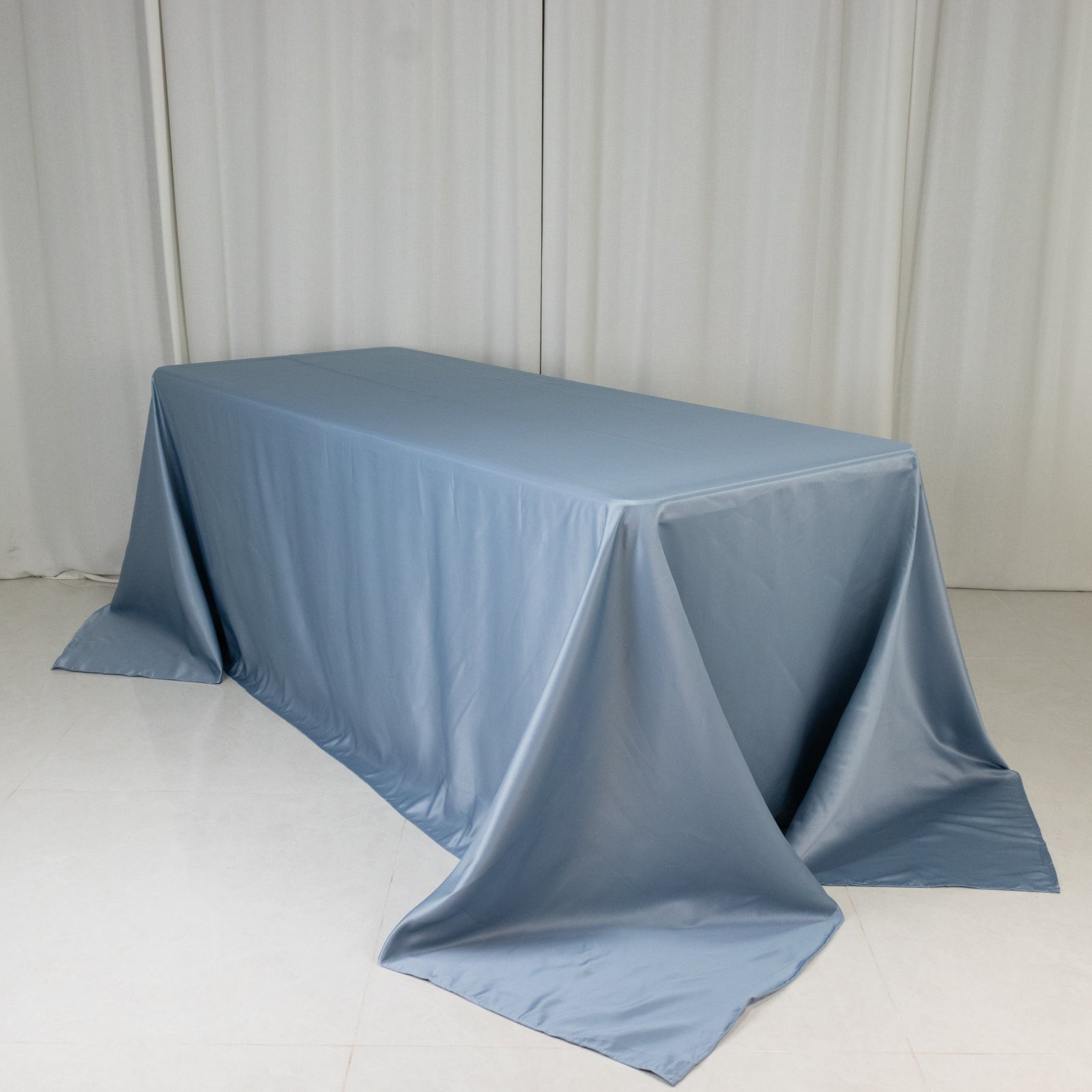 Dusty blue satin tablecloth for 6 foot table with floor-length drop.