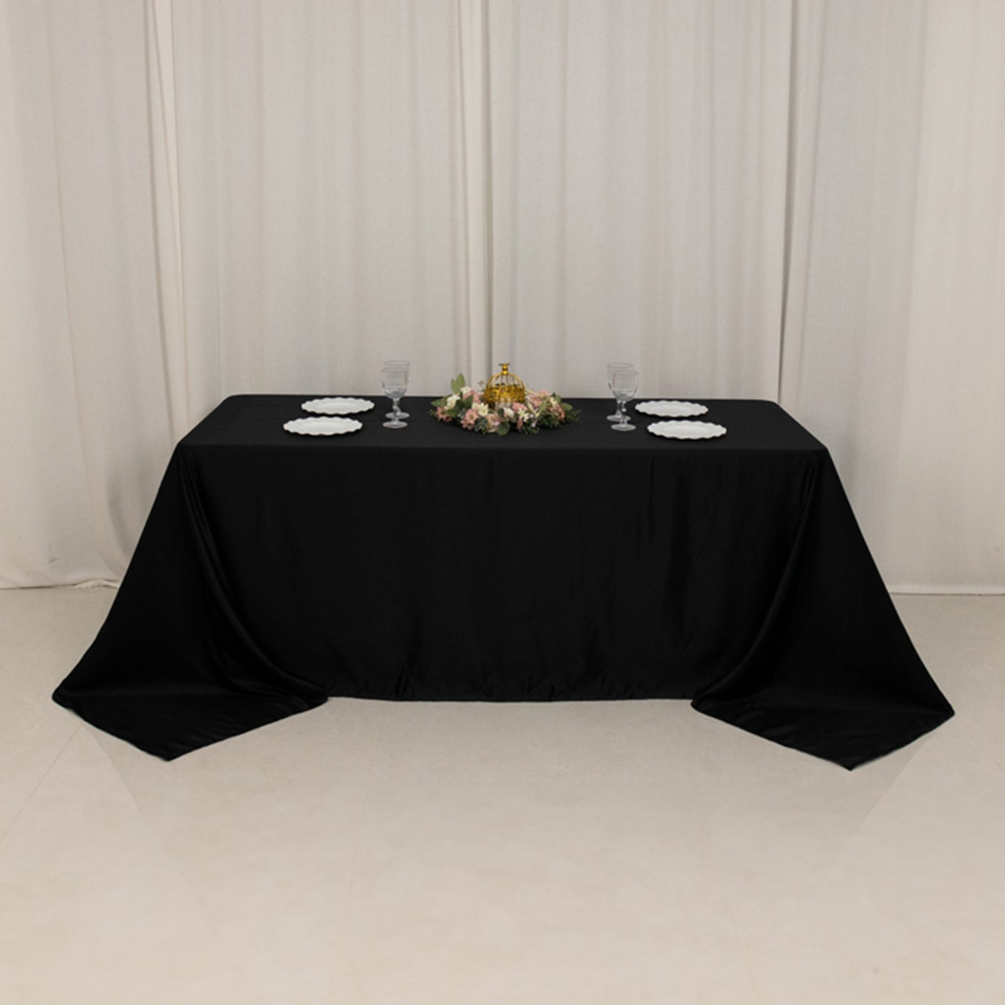Black satin rectangle tablecloth for a 6-foot table with floor-length drop.