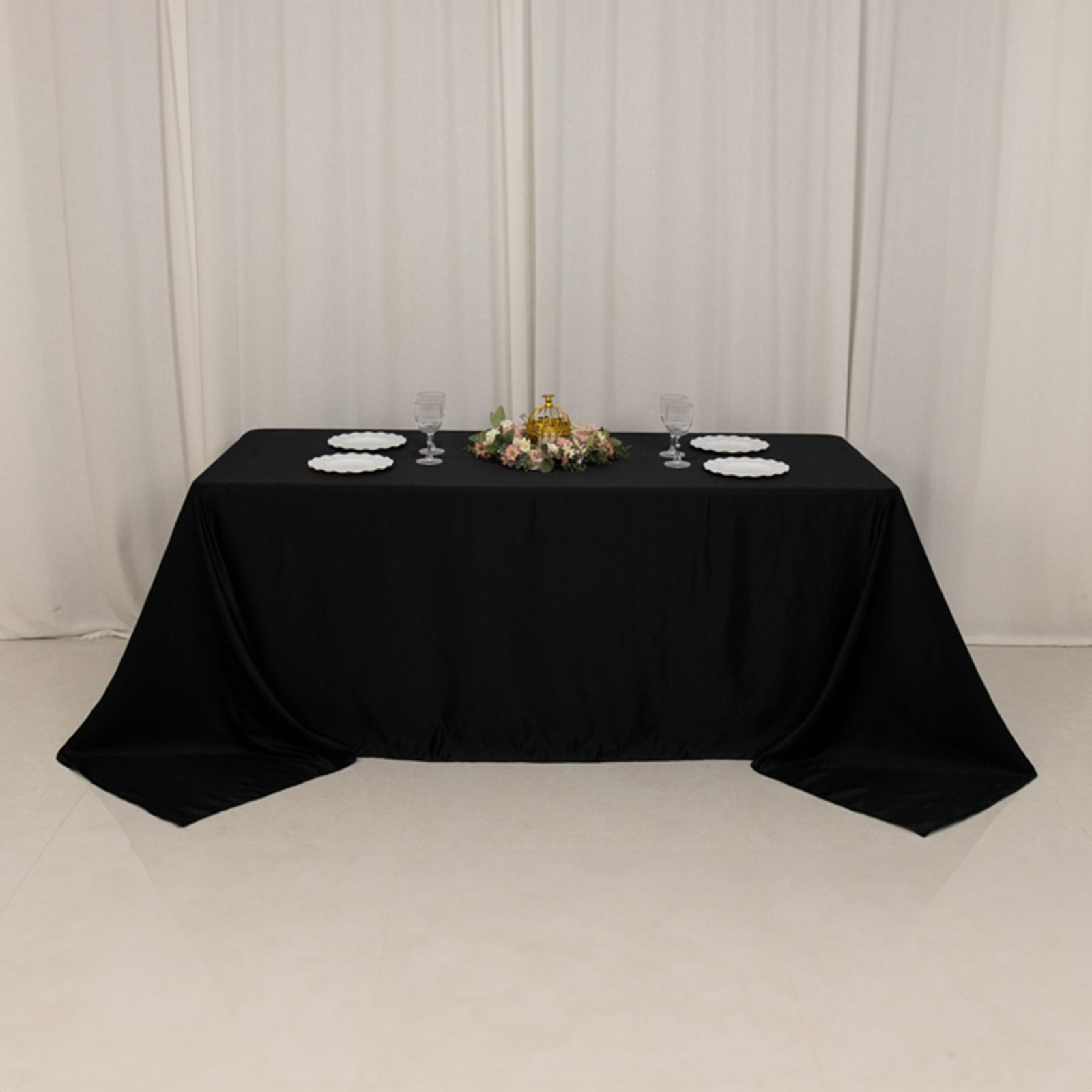 Black satin rectangle tablecloth for a 6-foot table with floor-length drop.