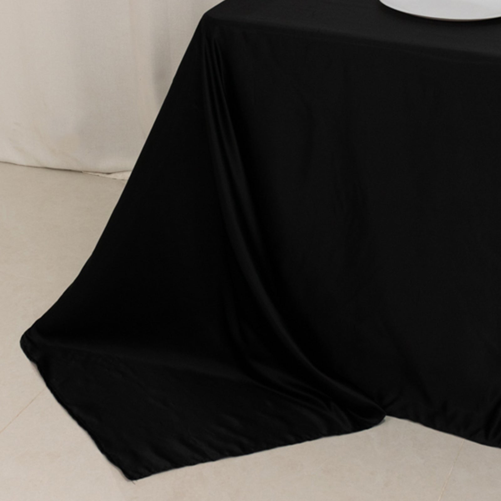 Black satin tablecloth for 6-foot table with floor-length drop.