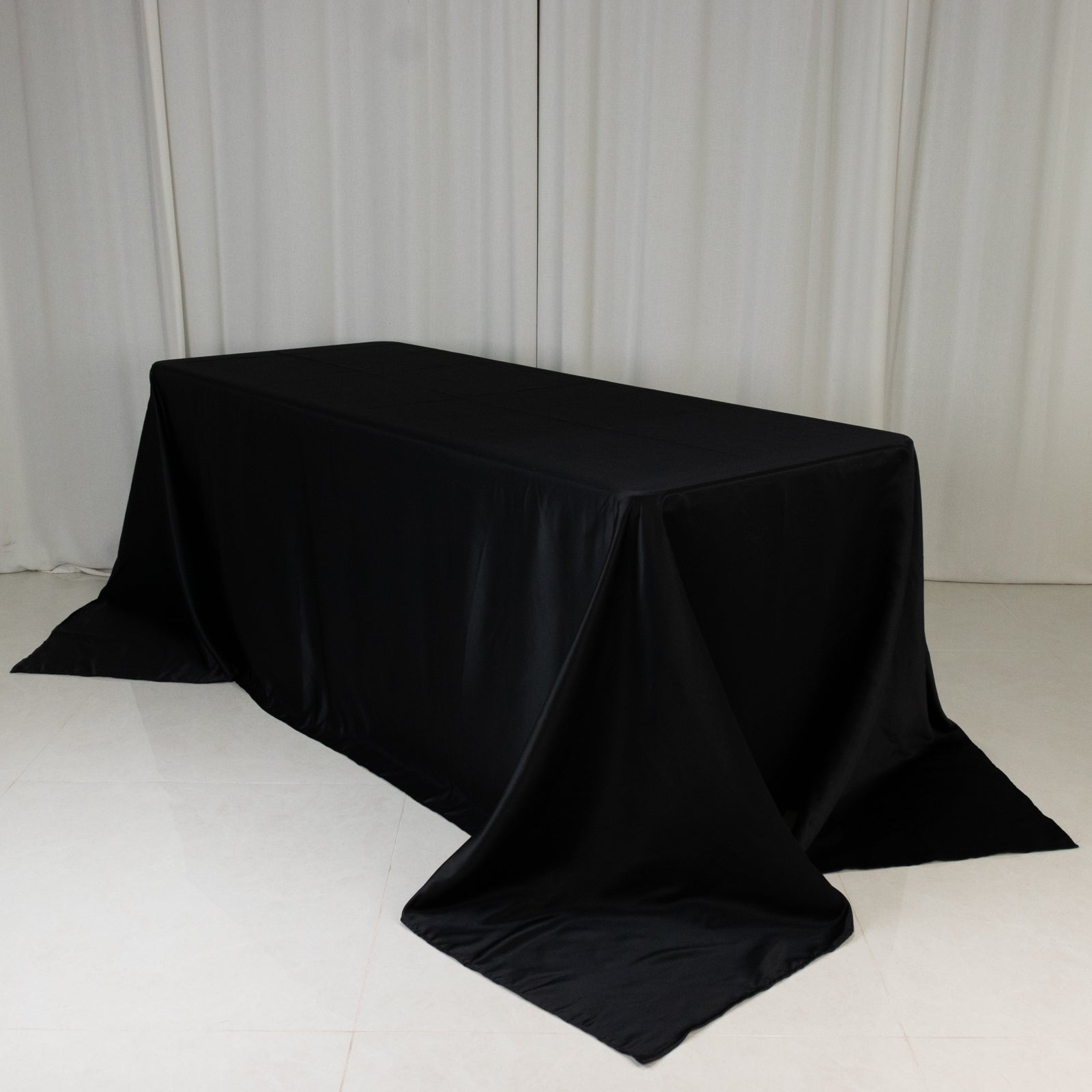 Black satin tablecloth for 6-foot table with floor-length drop.