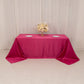 Fuchsia satin tablecloth for a 6-foot table with floor-length drop.